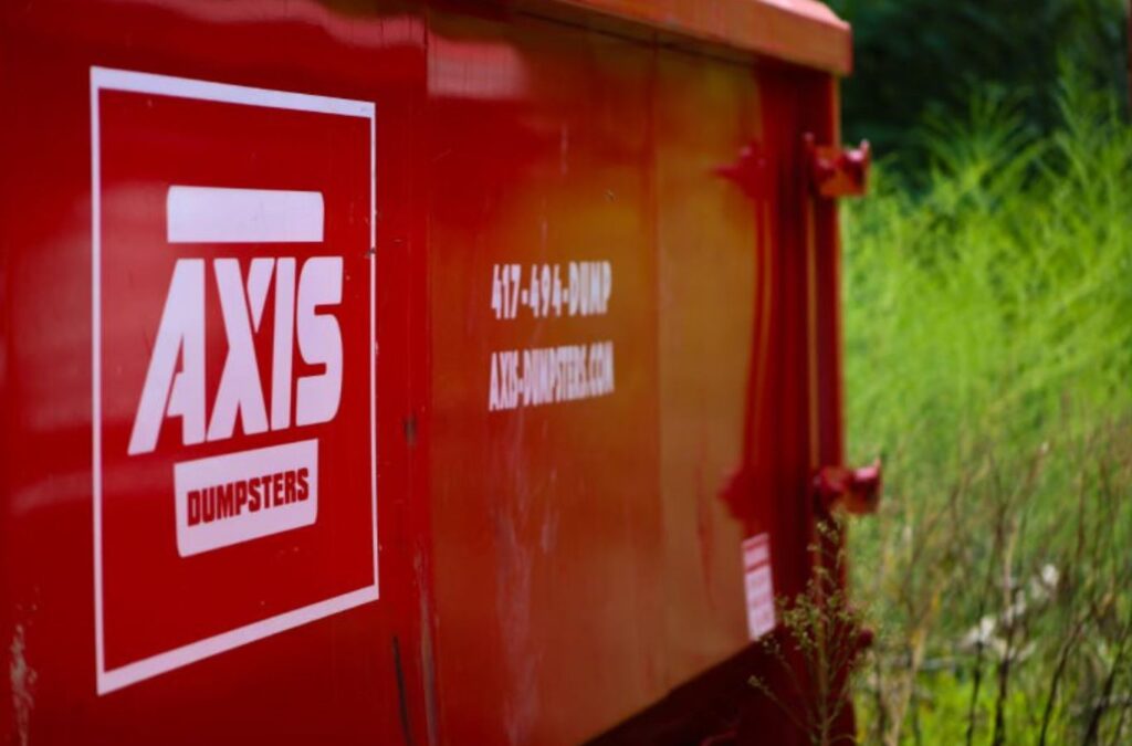 Axis Dumpsters team assisting a homeowner in Rogersville, MO with yard waste cleanup, highlighting prompt, reliable dumpster rentals.